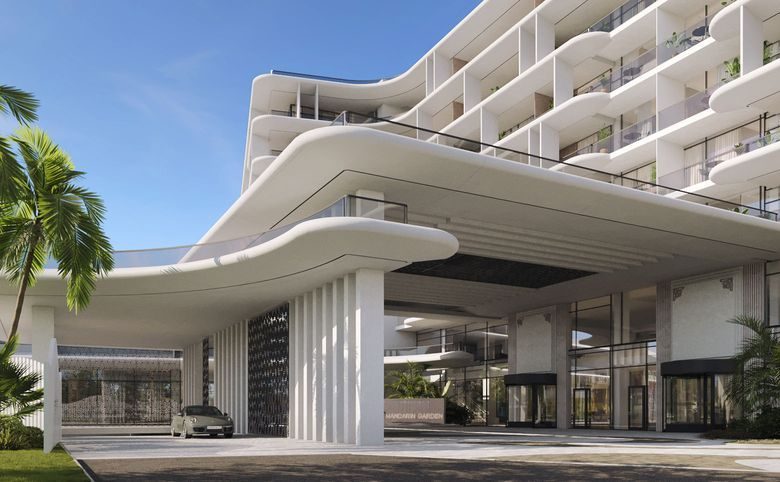Mandarin Garden Hotel — Скульптурный подъезд с закруглёнными формами фасада и колонн